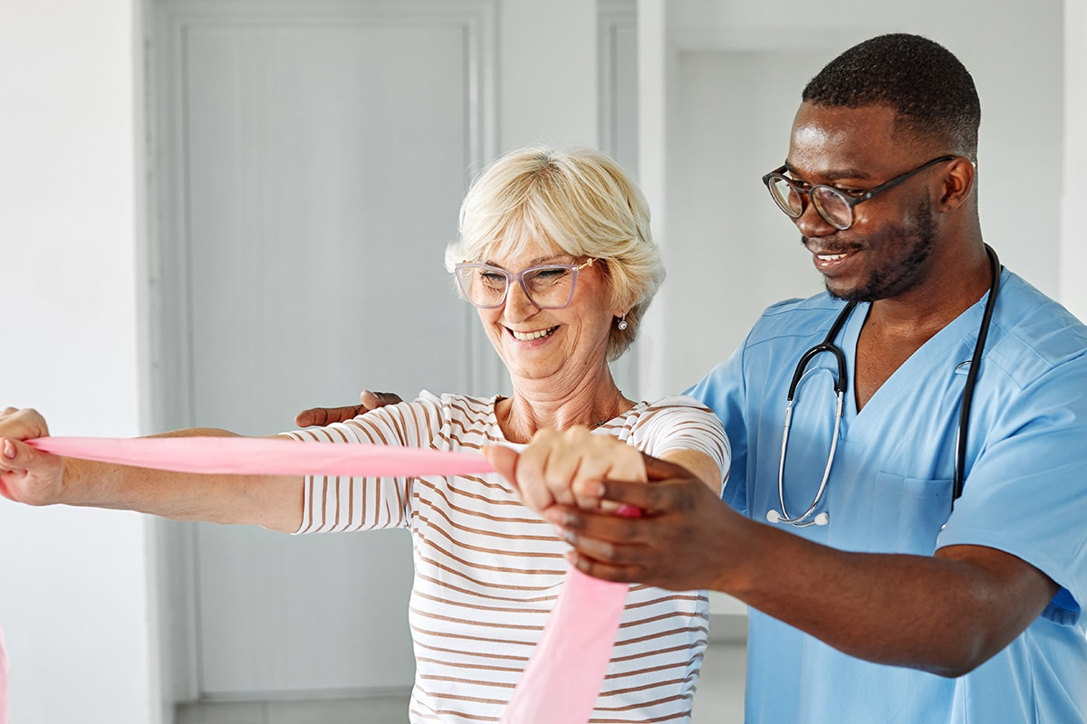 therapist senior woman exercise exercising patient physical therapy