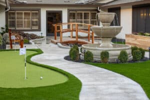green lawn and mini golf course with fountain at auburn oaks care center